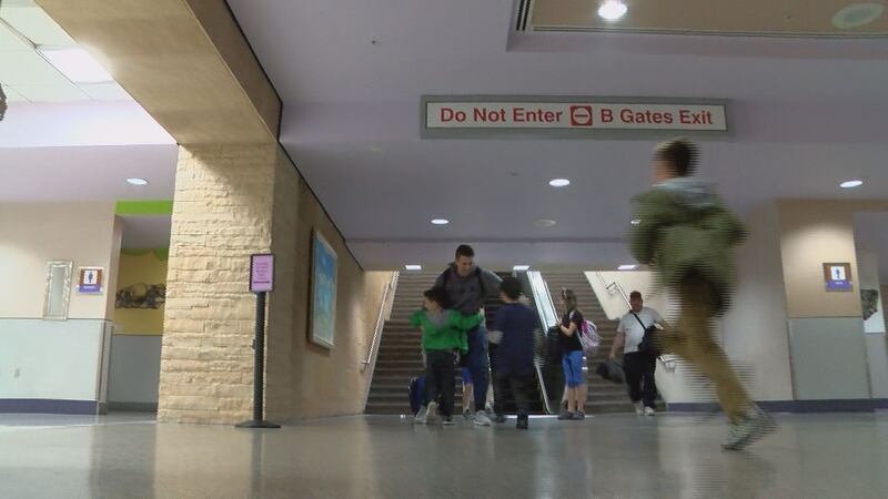 Holiday travelers await for family members, flights and luggage at the Tucson International...