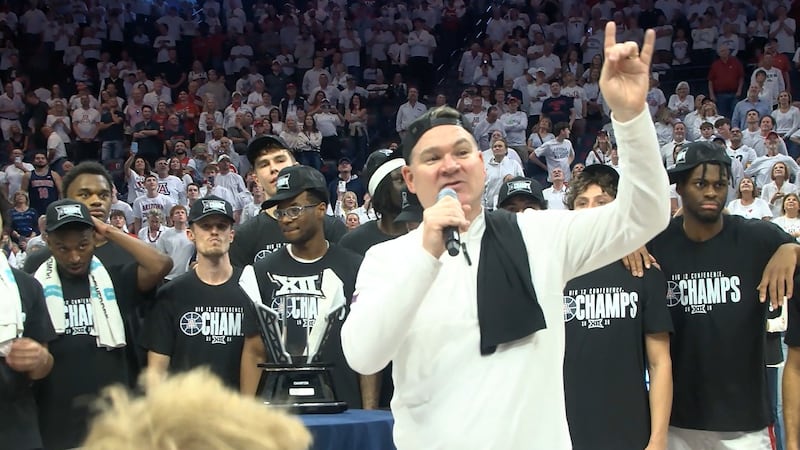 University of Arizona head coach Tommy Lloyd celebrates after the Wildcats clinched the...