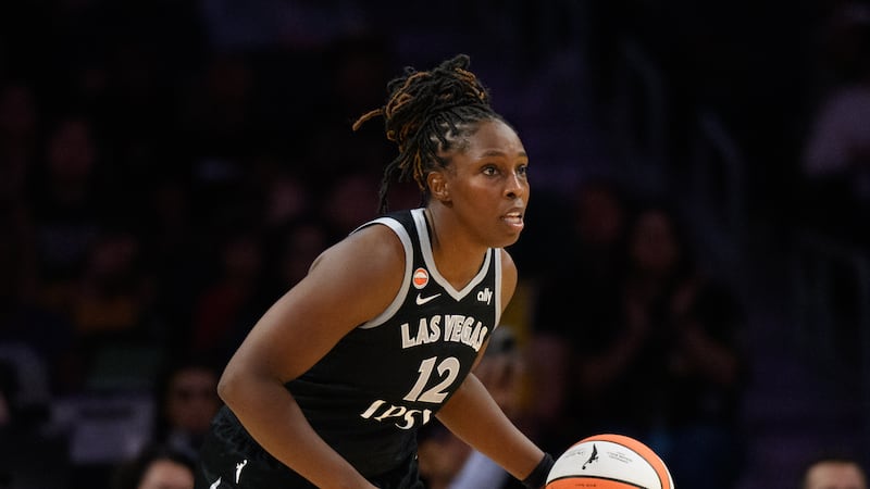 Las Vegas Aces guard Chelsea Gray (12) dribbles during a WNBA basketball game against the Los...