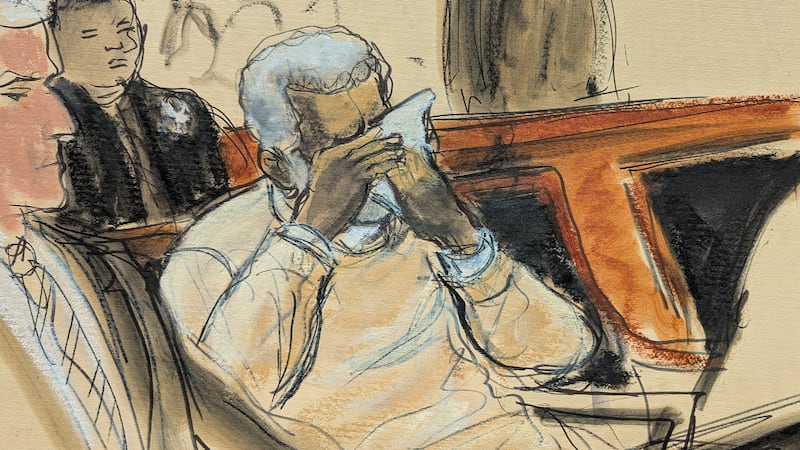 In this courtroom sketch, Sean Diddy Combs breaks down and cries during the playing of a video...
